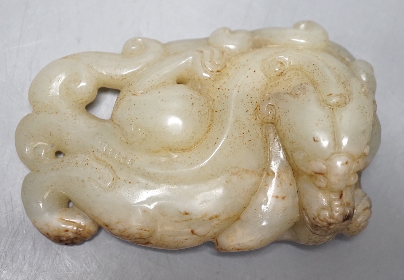 A Chinese pale celadon jade chilong carving, 10cm